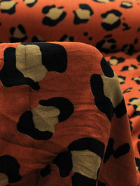 Tecido Crepe de Viscose Barrado Correntes e Animal Print Laranja