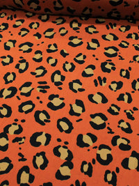 Tecido Crepe de Viscose Barrado Correntes e Animal Print Laranja