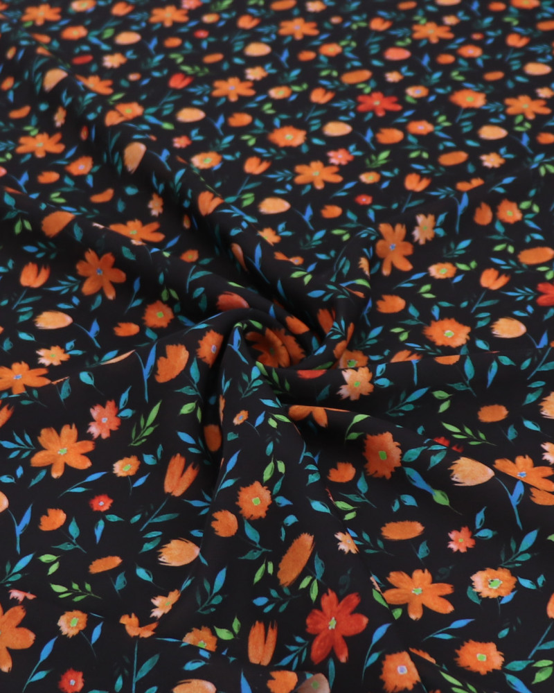 Tecido Crepe Koshibo Leve Italiano Campo de Flores Laranja e Preto