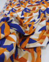 Tecido Viscose Texturizada Folhagem Abstrata Laranja, Azul e Branco