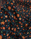 Tecido Crepe Koshibo Leve Italiano Campo de Flores Laranja e Preto
